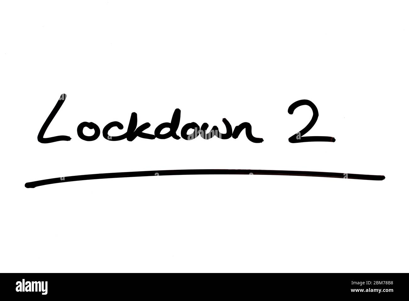 Lockdown 2 handwritten on a white background. Stock Photo