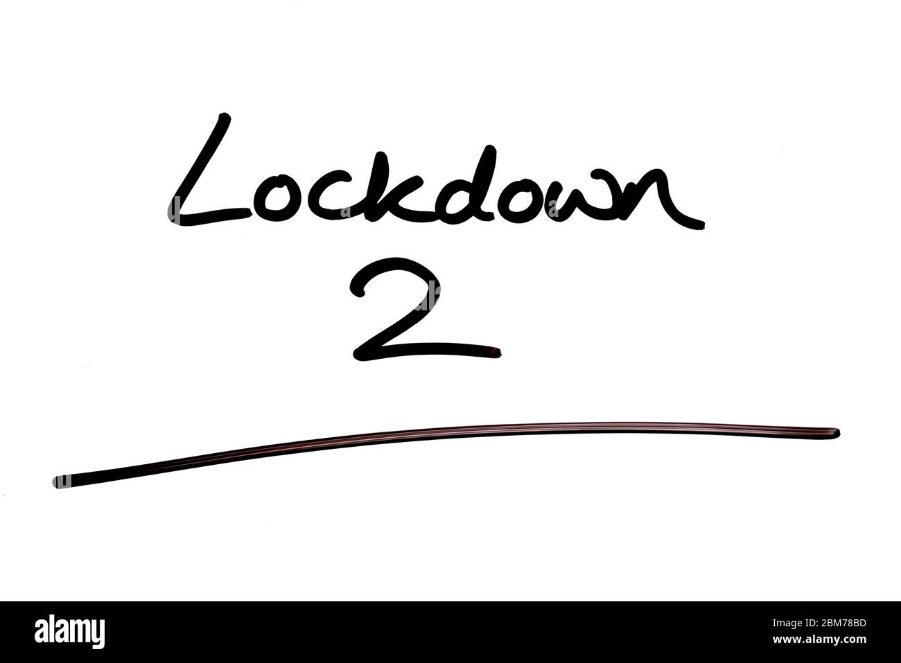 Lockdown 2 handwritten on a white background. Stock Photo