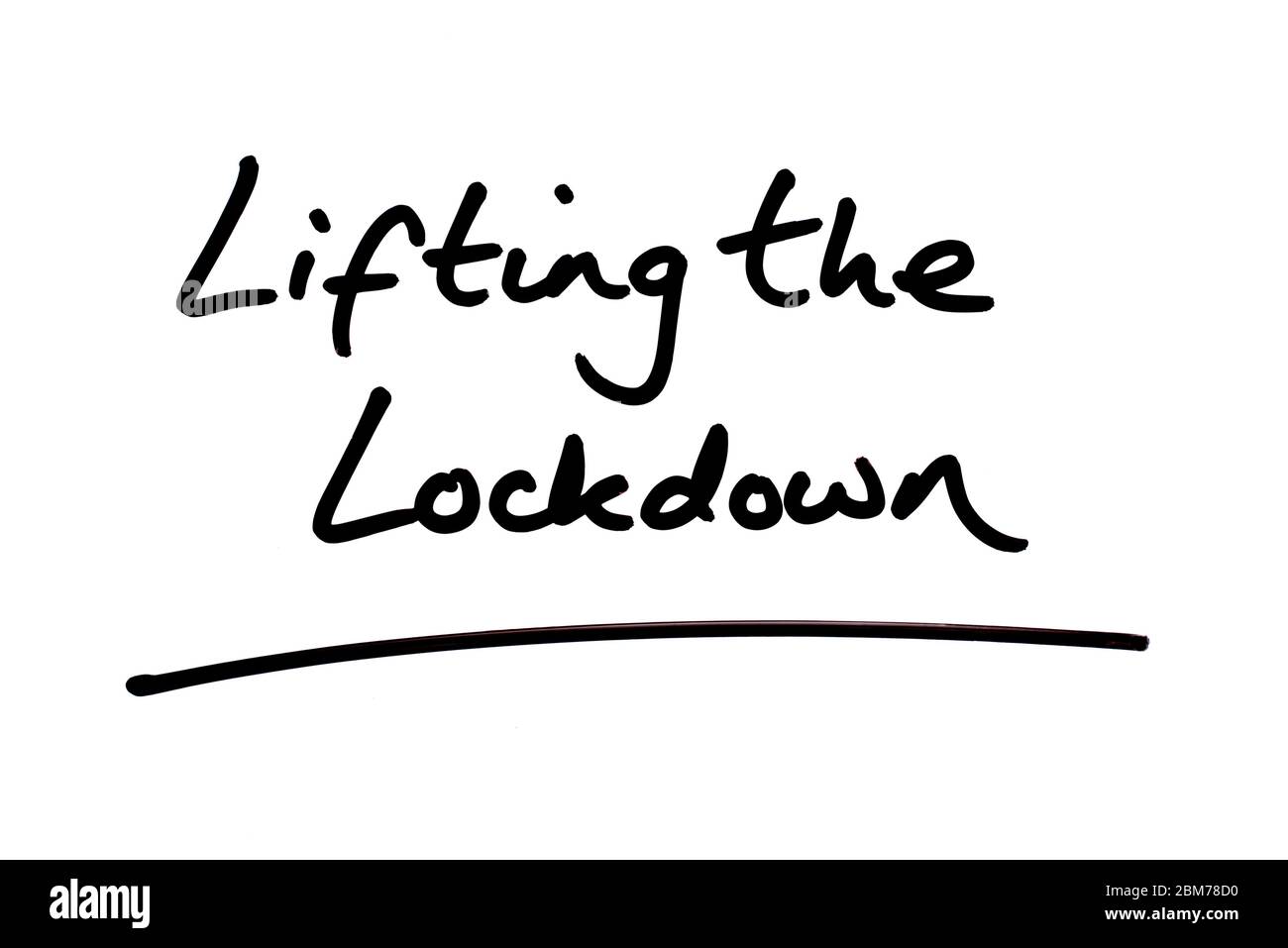 Lifting the Lockdown handwritten on a white background. Stock Photo