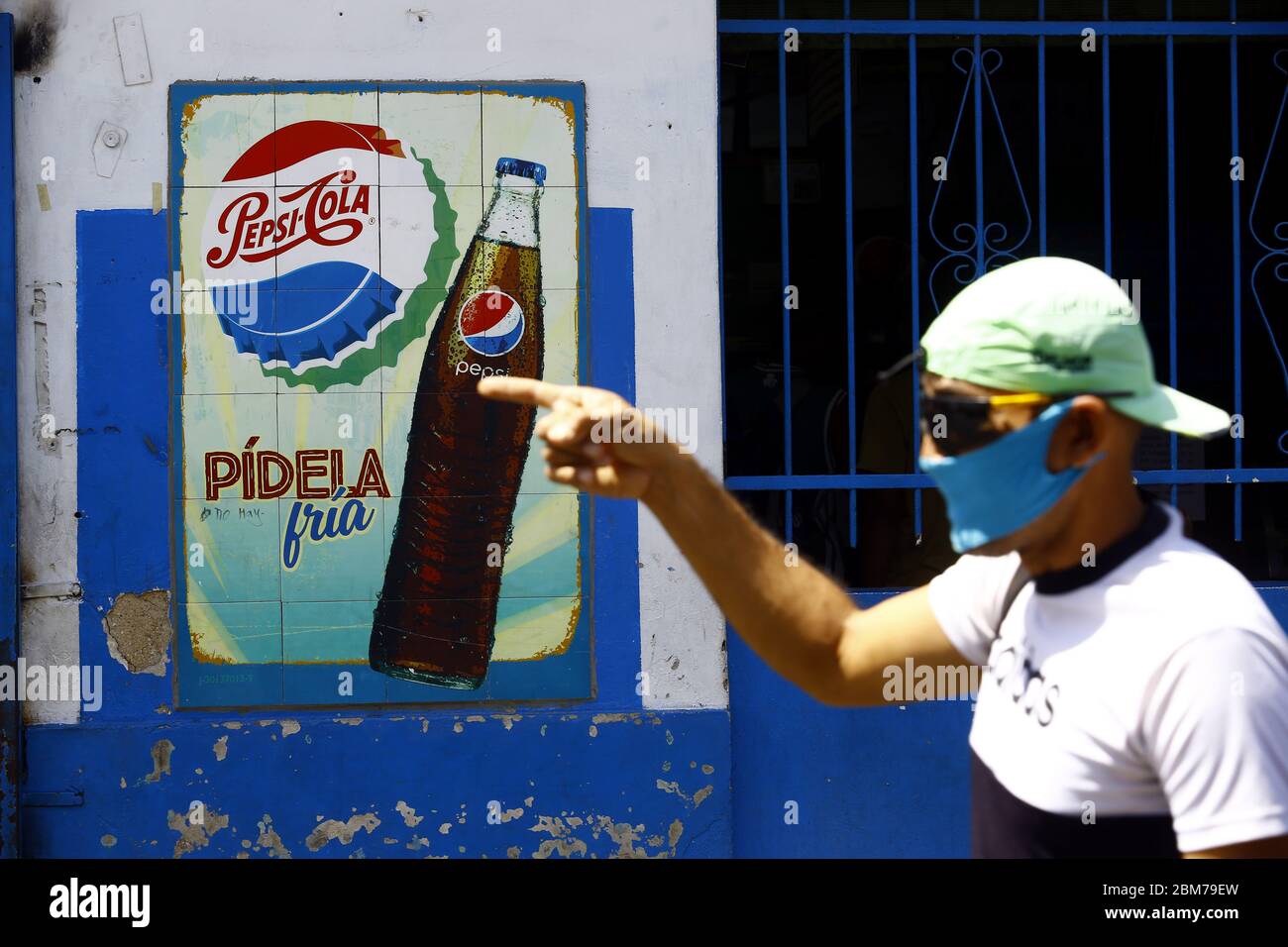 Guacara Carabobo Venezuela 4th May May 04 A Man Walks In Front Of A Pepsi Cola Advertising Grafitty Located In The City Center Of Guacara Carabobo State Photo Juan Carlos