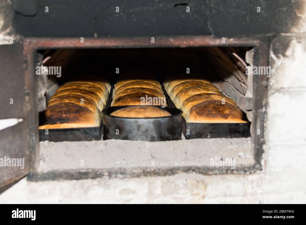 Fresh and crunchy home made bread, baked in traditional stone wood oven.  Homemade fresh and crusty wheat dough bread, prepared in firewood, natural  an Stock Photo - Alamy