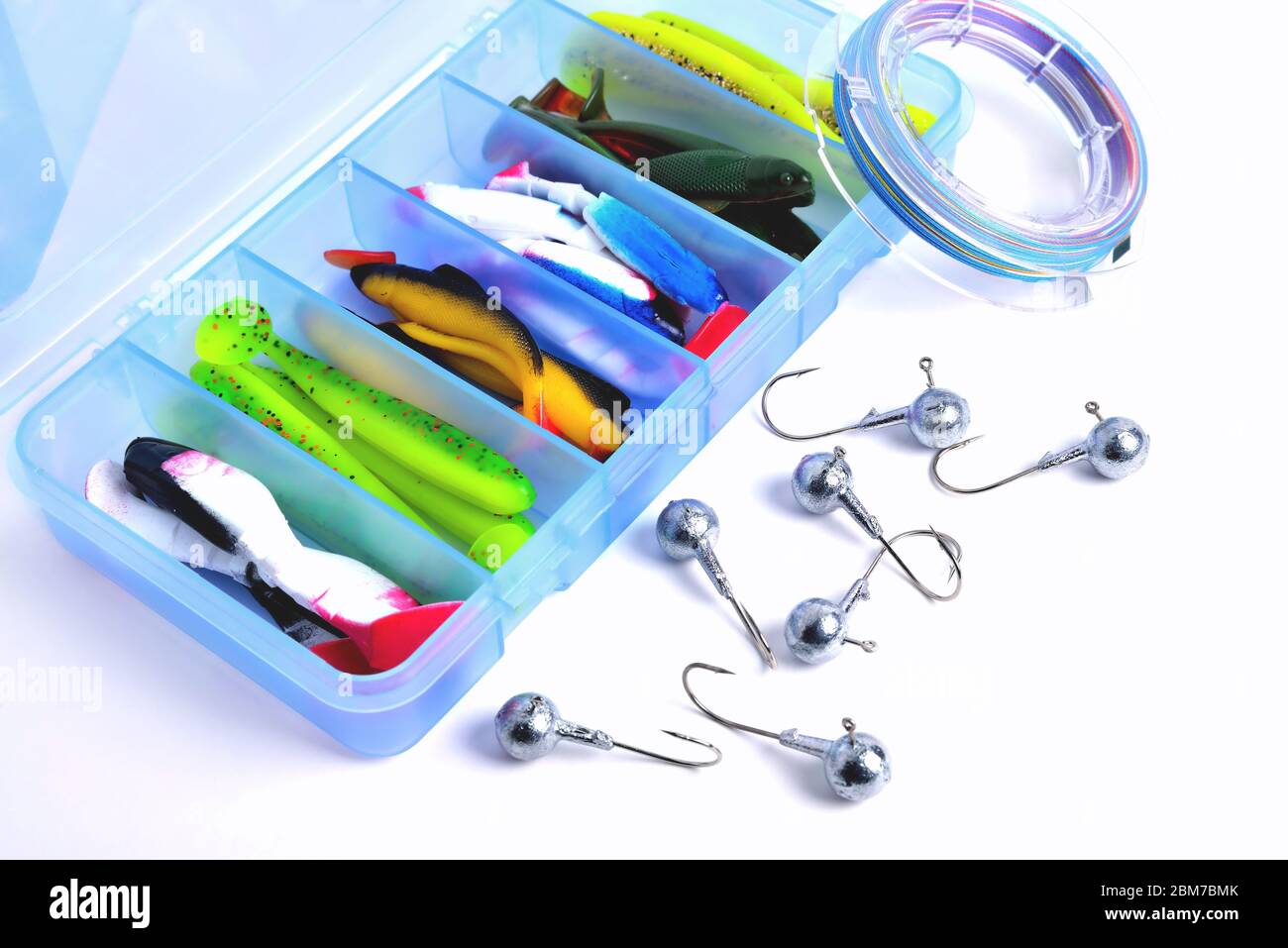 Jig silicone fishing lures in plastic tackle lure box. Silicone fishing  baits isolated. Colorful baits. Fishing spinning bait. Silicone soft plastic  Stock Photo - Alamy