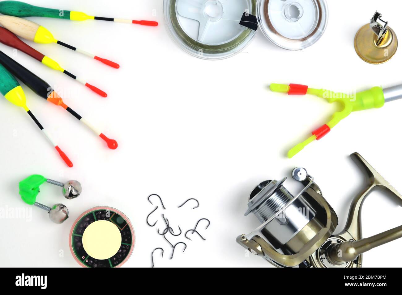 fishing accessories, accessory box, fishing reel, hooks, fishing line,  floats on a white background, a place for copy space Stock Photo - Alamy