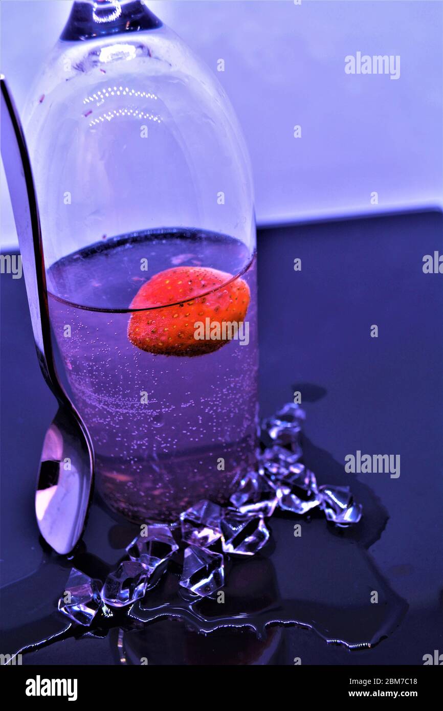 upside down glass strawberry drink with ice Stock Photo