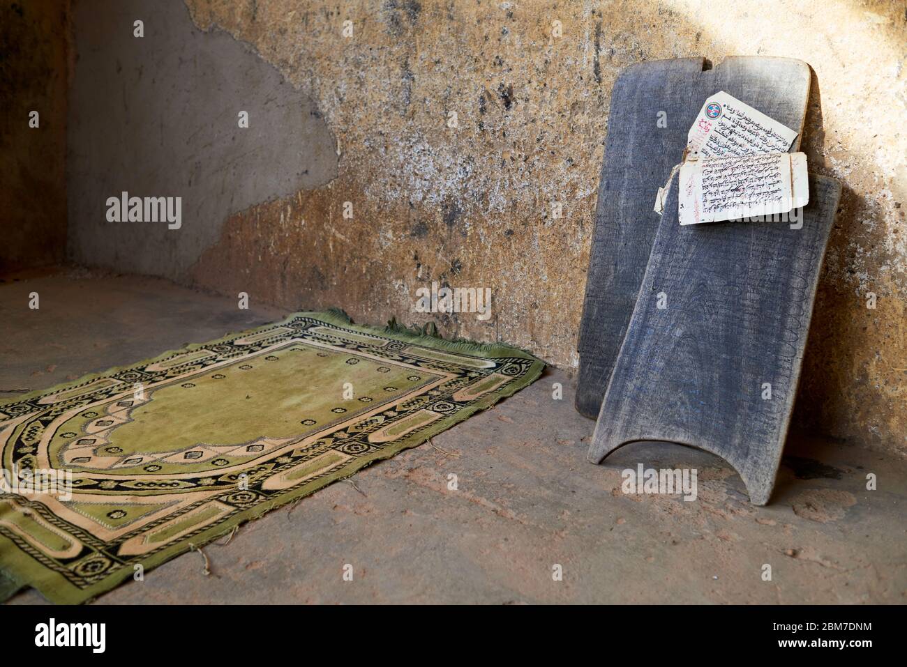 Arabic scriptures and muslim prayer mat Stock Photo Alamy