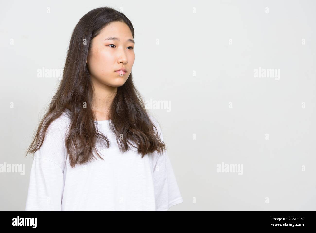 Portrait of young beautiful Asian woman thinking Stock Photo - Alamy