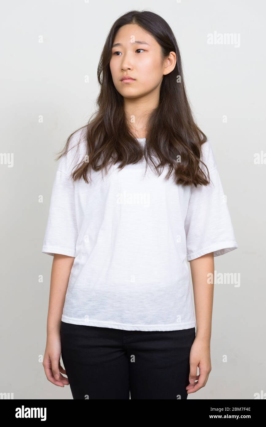 Portrait of young beautiful Asian woman thinking Stock Photo - Alamy