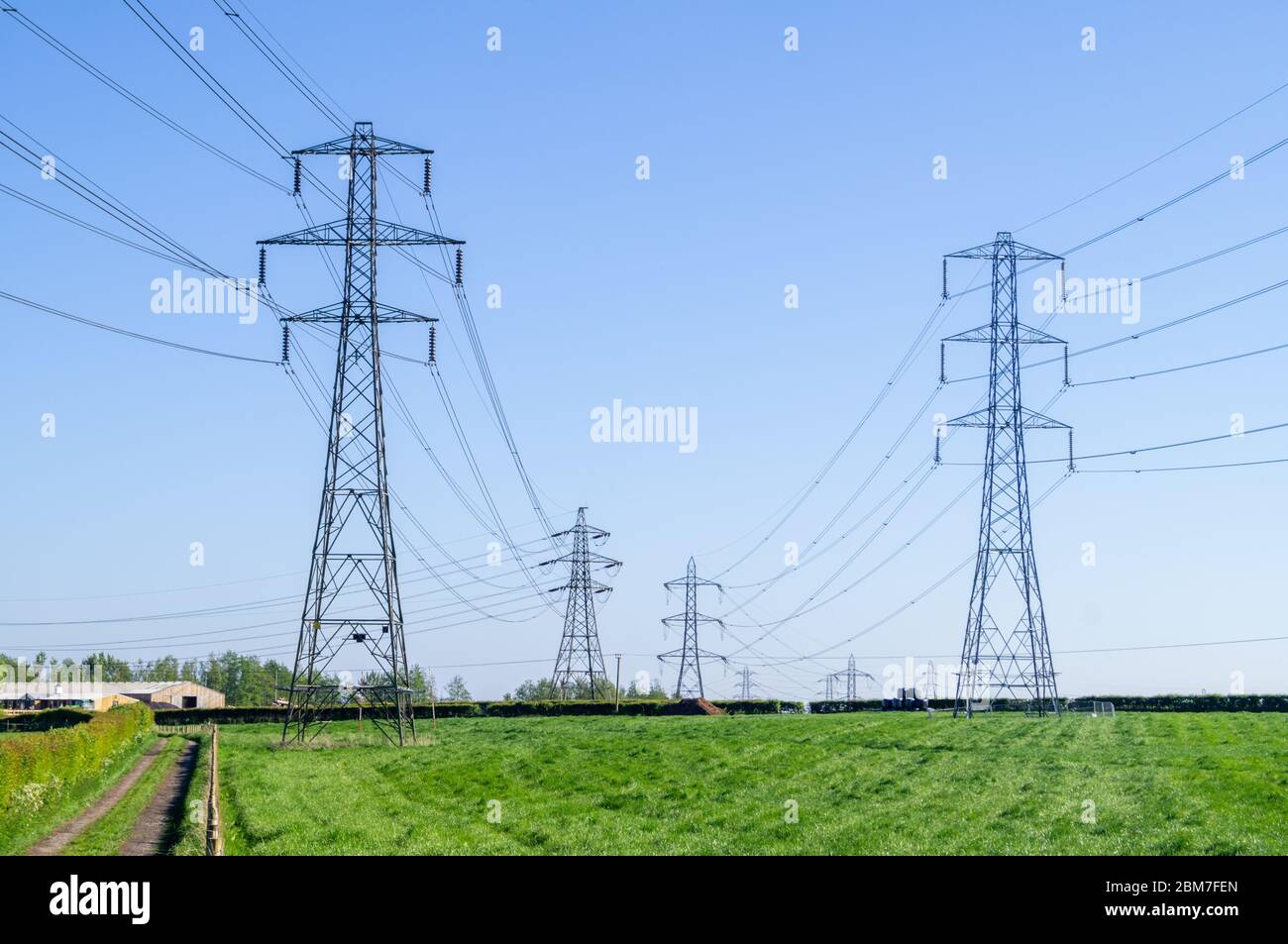 Electricity pylons in England English pylons power tower fields field