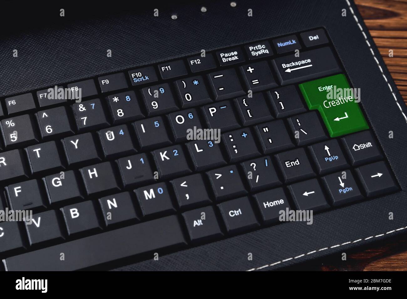 Computer keyboard. The "Creative" keyboard button is green for the network community concept. close-up Stock Photo