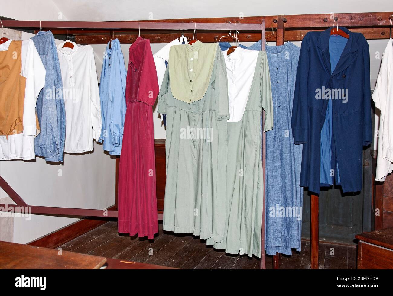 Shaker clothing hanging, plain colors, simple style, Shaker Village of Pleasant Hill, defunct religious community; Kentucky; USA, Harrodsburg; KY Stock Photo