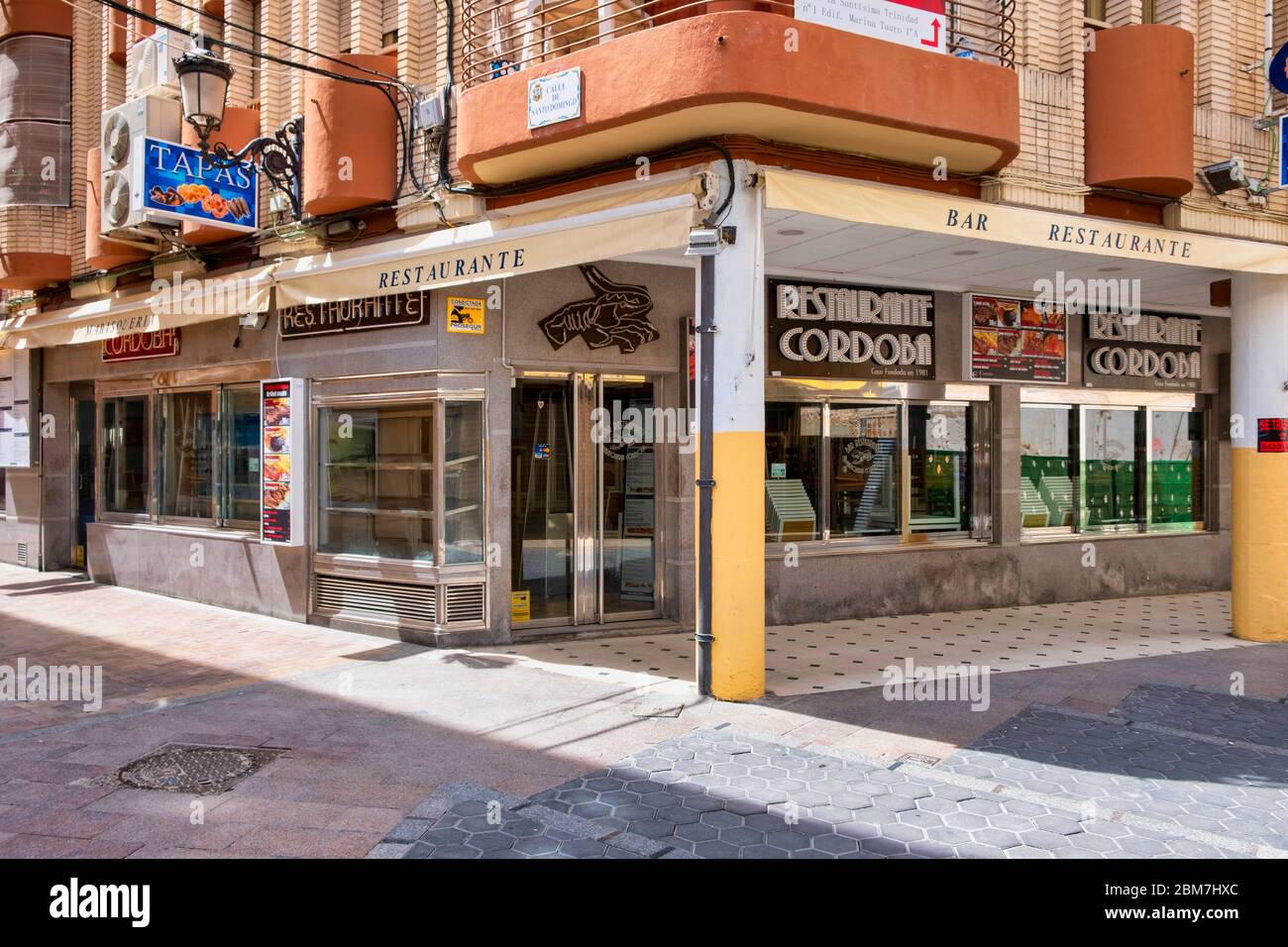 Benidorm, Alicante Spain, 4.5.2020, Corona crisis: closed tapas restaurants in Calle Santo Domingo of the old town. usually the place is densely crowded with people at midday Stock Photo