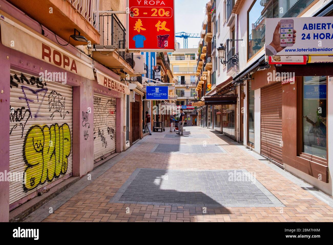 Benidorm, Alicante Spain, 4.5.2020, Corona crisis: closed tapas restaurants in Calle Santo Domingo of the old town. usually the place is densely crowded with people at midday Stock Photo