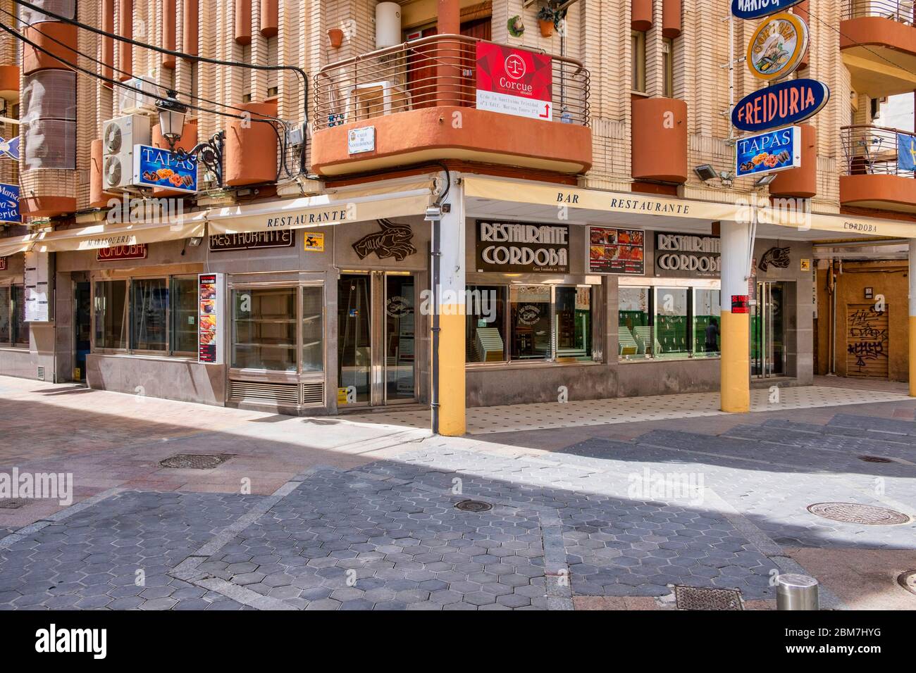 Benidorm, Alicante Spain, 4.5.2020, Corona crisis: closed tapas restaurants in Calle Santo Domingo of the old town. usually the place is densely crowded with people at midday Stock Photo