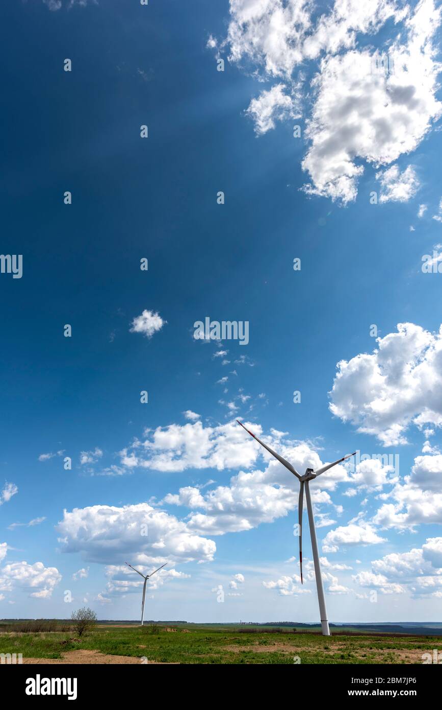 Wind turbines with beautiful clouds Stock Photo - Alamy