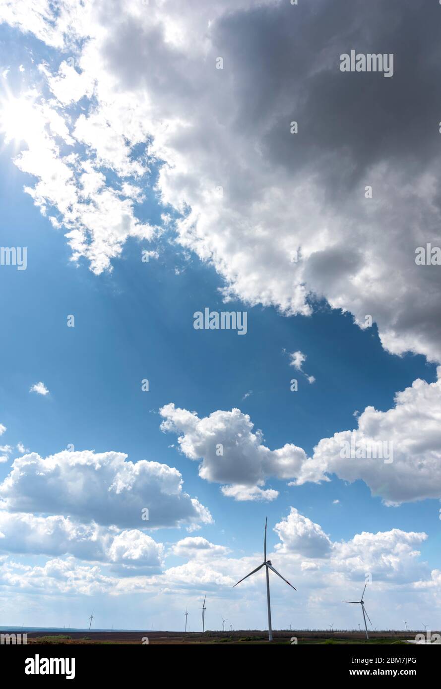 Wind turbines with beautiful clouds Stock Photo - Alamy