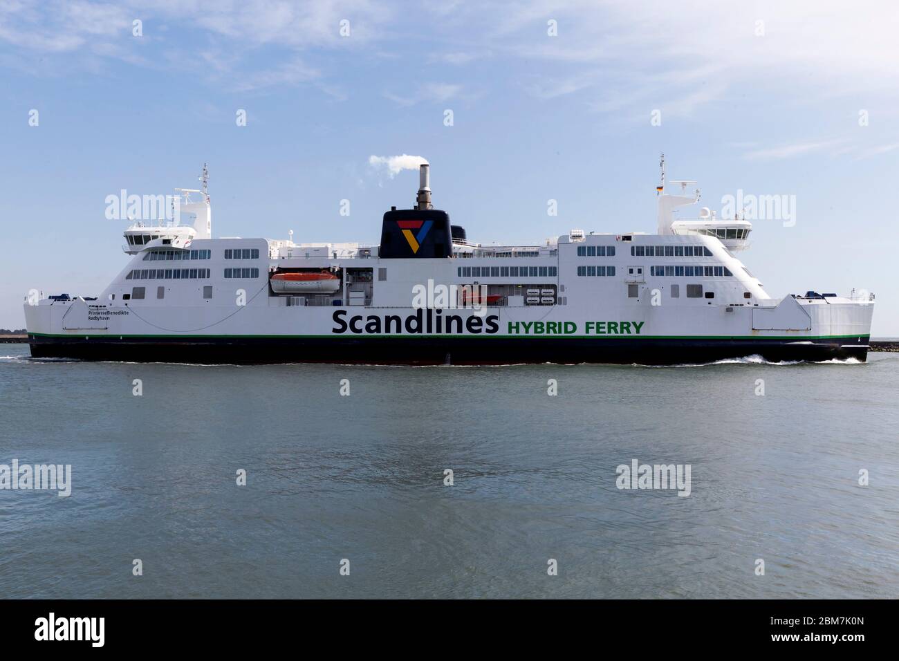 RODBY, DENMARK - MAY 06, 2020:  The Rødby – Puttgarden ferry leaves Rødby Harbor. The Danish – German ferrry connection will be replaced by the Fehmernbelt Tunnel by 2029. The tunnel project begins in 2021 and will cost some 55 bn DKK .The 18 KM tunnel will be the largest in the world of its kind.  Cuerrently Archaeologist at the Lolland-Falster Museum are excavating the landarea next to the tunnel and have revealed a 2.000 years old Iroon Age defence system Stock Photo