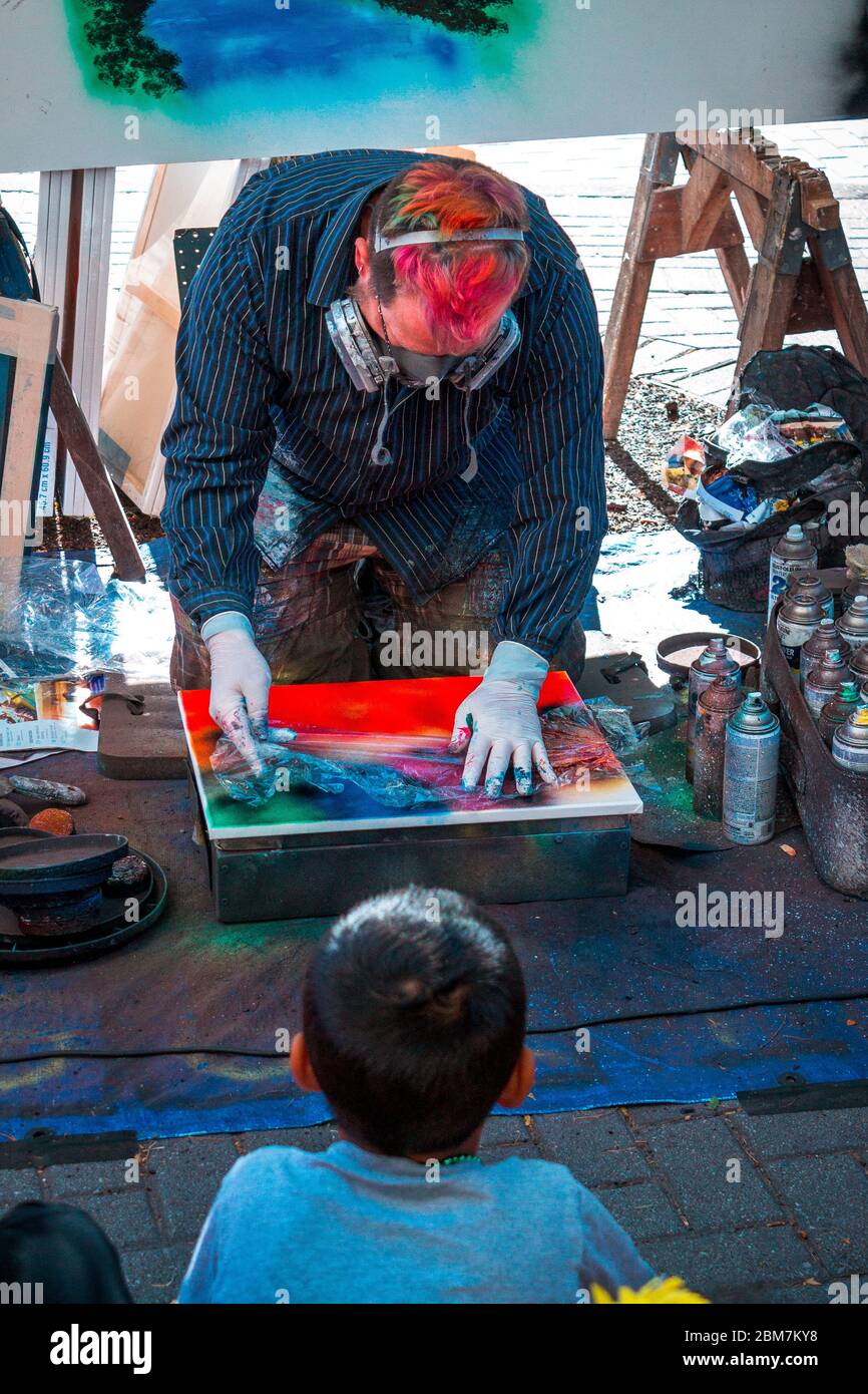 Spray paint artist showing off his craft at Artprize 9 Stock Photo - Alamy