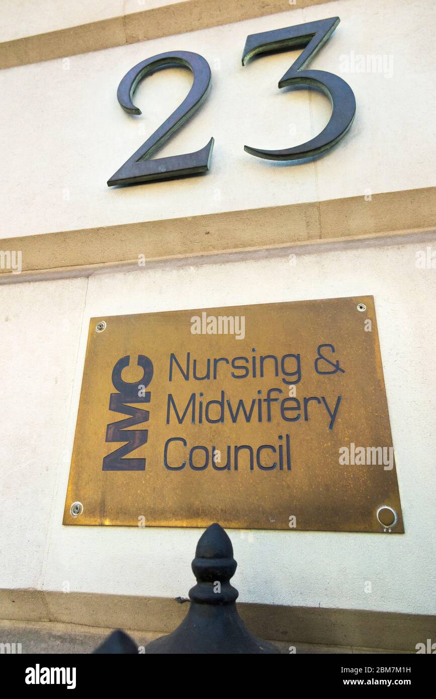 Brass name plate / plaque outside the offices of The Nursing and Midwifery Council – NMC at 23 Portland Place London W1B 1PZ. UK. (118) Stock Photo