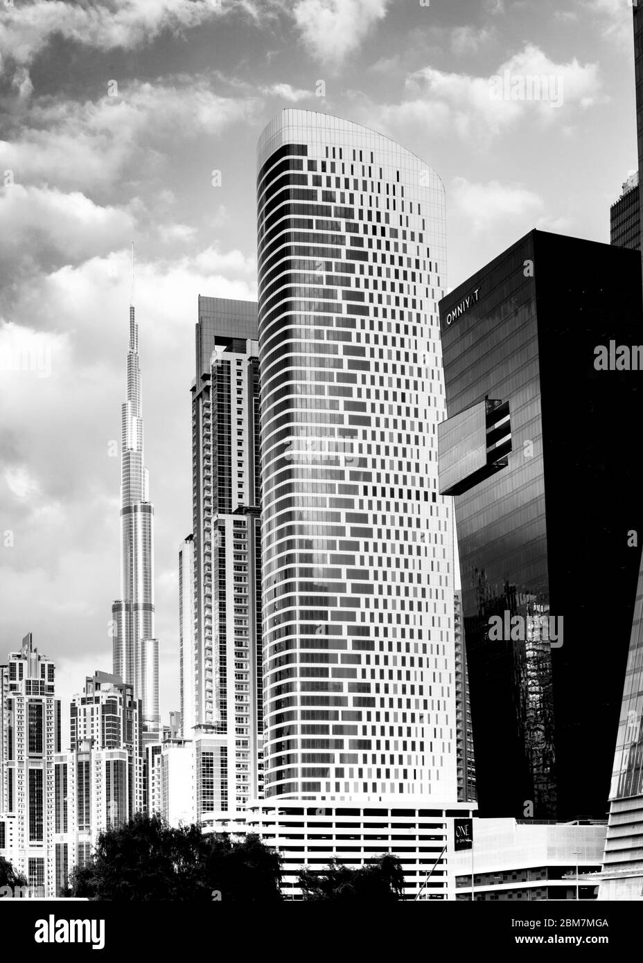vertical image of modern architecture in the business district,multi buildings close together,in the distance burj Khalifa  Dubai,middle East, Stock Photo