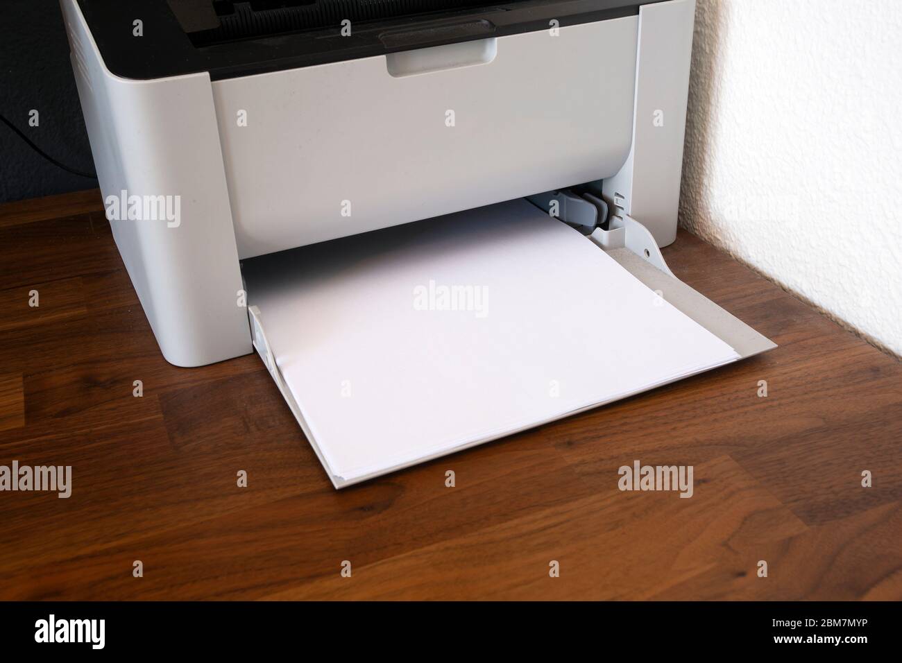 Office digital printer, copier and paper on wooden desk, fax machine  close-up Stock Photo - Alamy