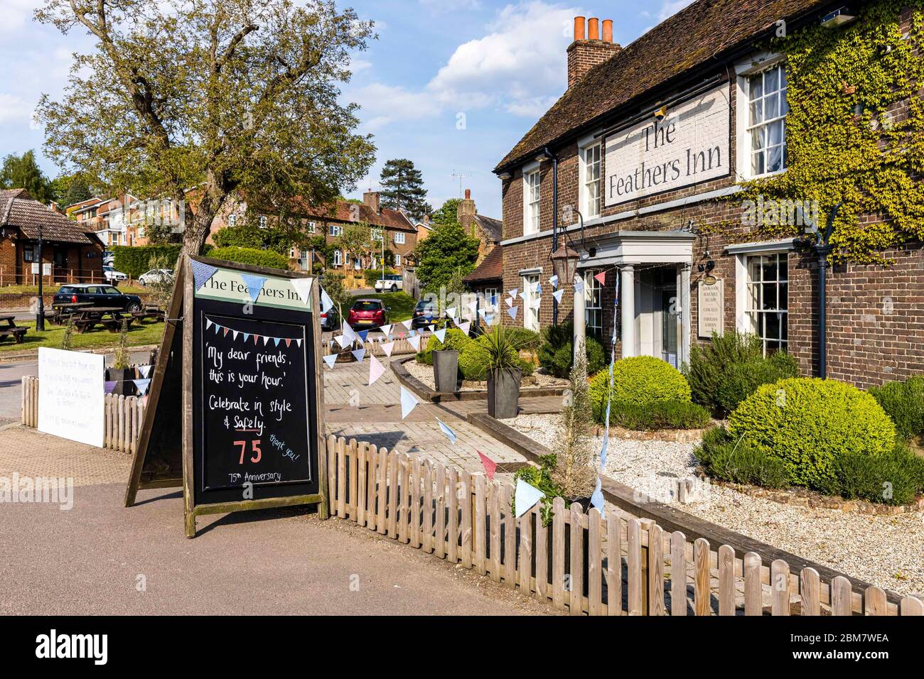 East Hertfordshire, United Kingdom. 07 May, 2020 Pictured: Despite being unable to open due to the COVID-19 restrictions, The Feathers pub in Wadesmill, Hertfordshire has put up bunting and messages to celebrate the VE Day 75th anniversary. Credit: Rich Dyson/Alamy Live News Stock Photo