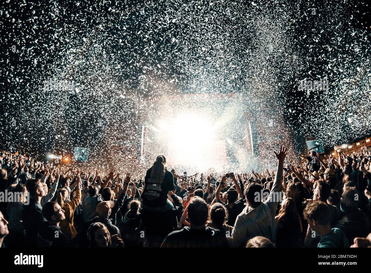 silhouette festival crowd with confetti Stock Photo - Alamy