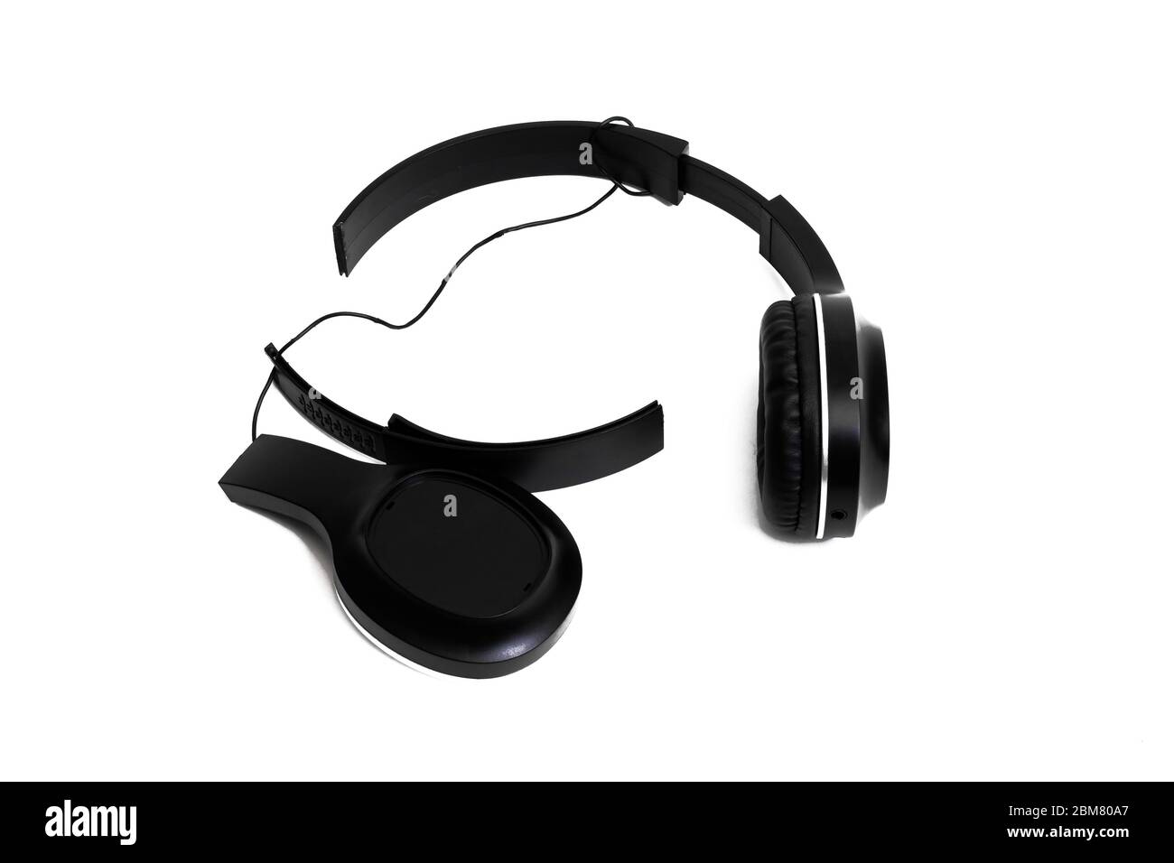 Broken black headphones isolated on white background Stock Photo Alamy