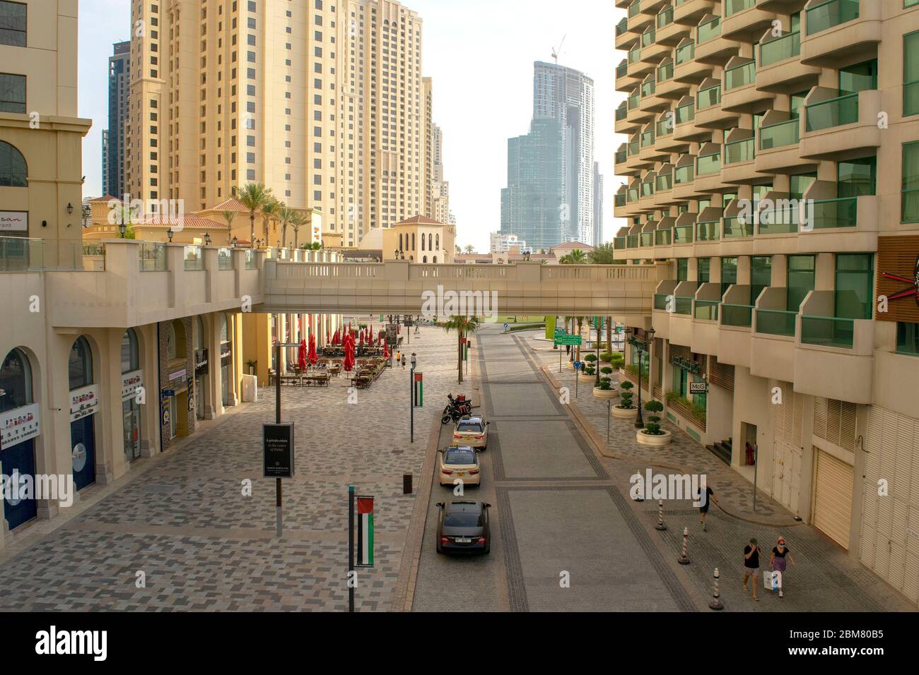Dubai/UAE - May 7, 2020: View on JBR main street. Jumeirah Beach Residence. Dubai road with light traffic during daytime. JBR walk. Top view Stock Photo