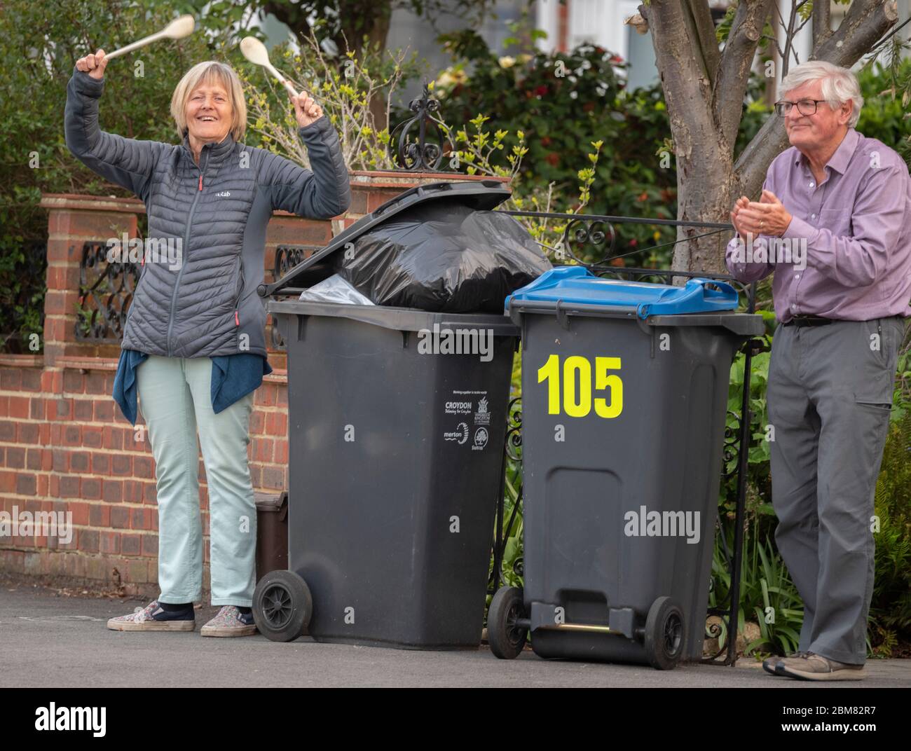 Merton Park, London, UK. 7 May 2020. Residents and neighbours of a leafy south London street clap for NHS and Carers at 8.00pm on a warm evening on day 45 of the Coronavirus lockdown. Credit: Malcolm Park/Alamy Live News. Stock Photo