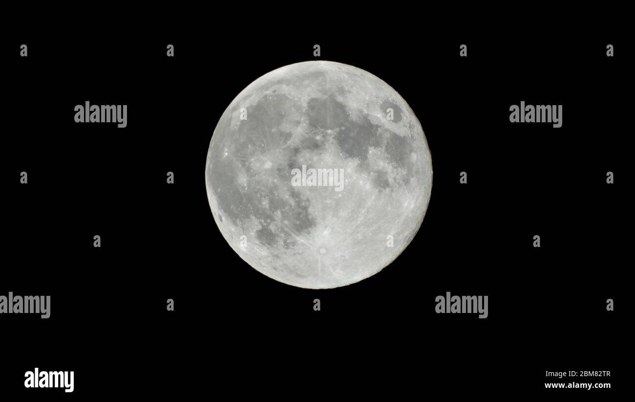 Supermoon in India at midnight Stock Photo Alamy