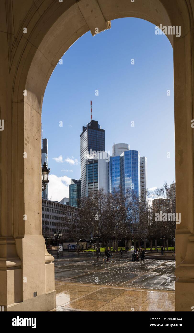 Financial buildings, including the 200m Main Tower, seen from the arched portico of the Alte Oper, Frankfurt am Main, Hesse, Germany. Stock Photo