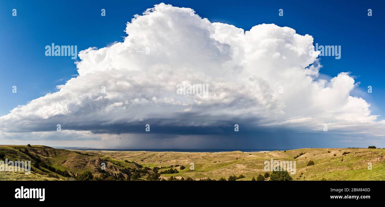 Scenic landscape panaroma of a thunderstorm cumulonimbus cloud over the Nebraska Sandhills Stock Photo