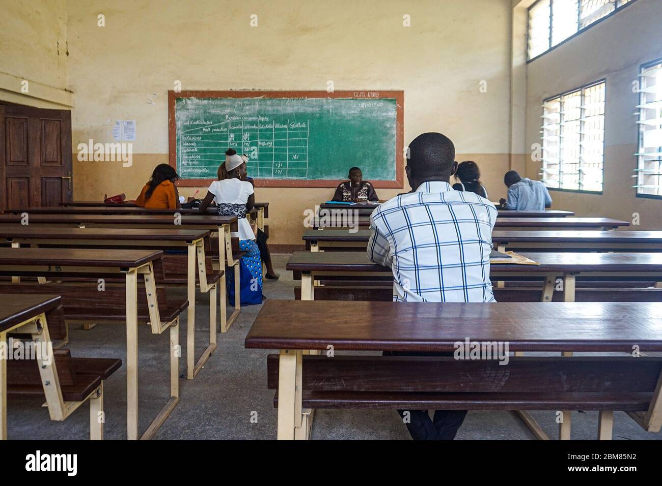 Professor Cheko Roger teaches a class at the University of Kisangani. The city is home to eight universities, which face a chronic shortage of professors. (Zita Amwanga, GPJ DRC) Stock Photo