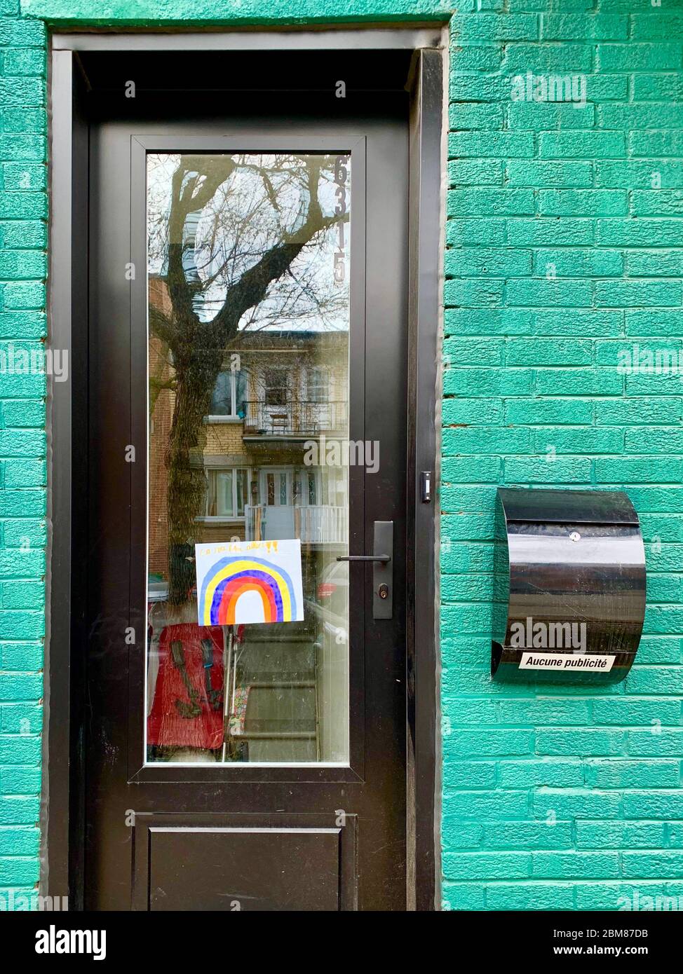 Rainbow of hope on a door in Montreal, Canada during the Covid19 Pandemic Stock Photo