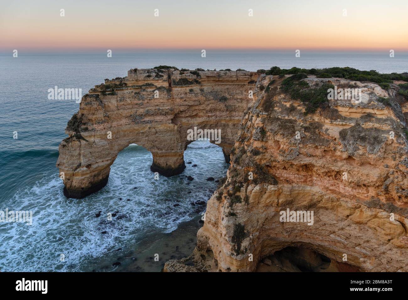 Amazing seascape at sunset at Marinha Beach in the Algarve, Portugal. Landscape with strong colors of one of the main holiday destinations in europe. Stock Photo