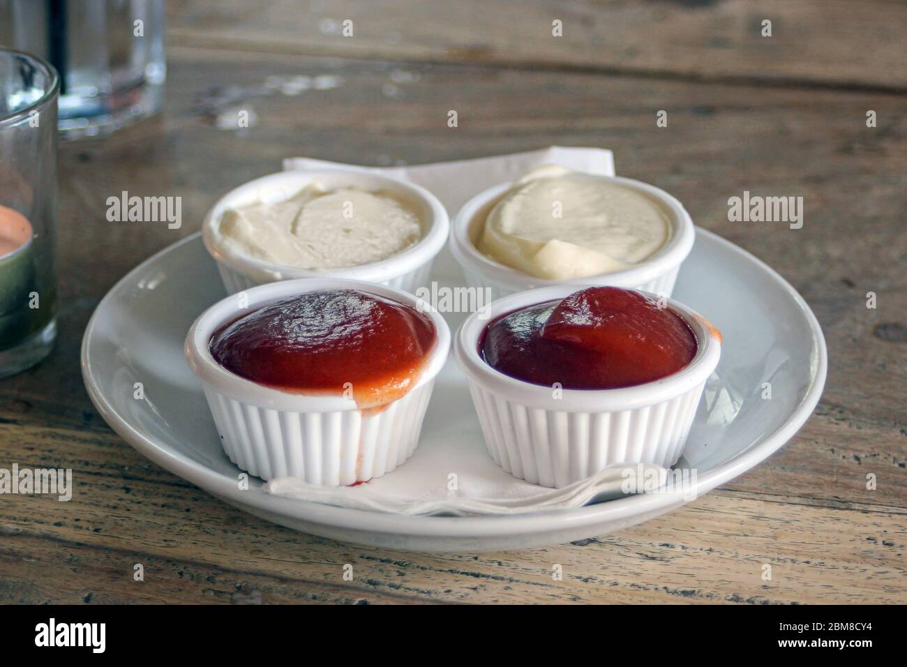 Ketchup and mayo on a pub table in Brighton, England, UK Stock Photo