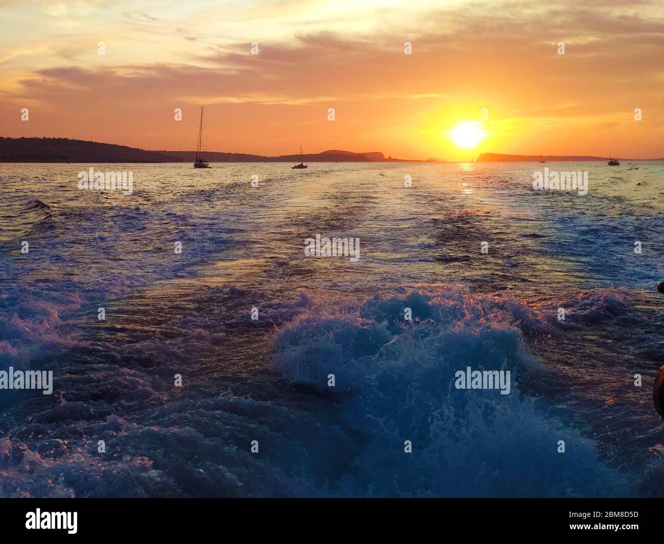 romantic sunset on the coast of the mediterranean sea in ibiza in spain Stock Photo