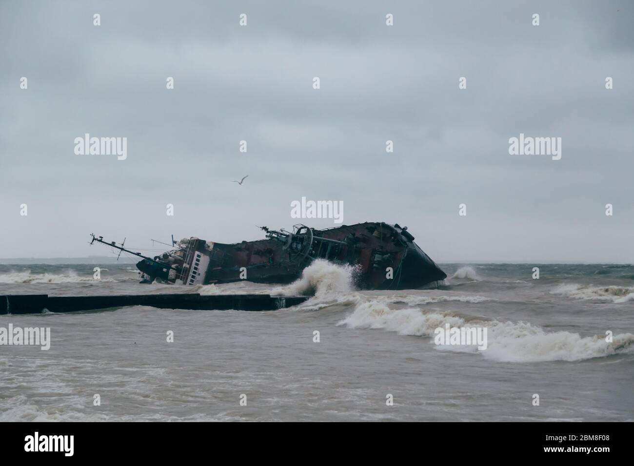 Odessa, Ukraine - November, 22 2019: A shipwreck of a tanker Delfi at the Black Sea coast. Ecological, environmental disaster, oil spill. Stock Photo