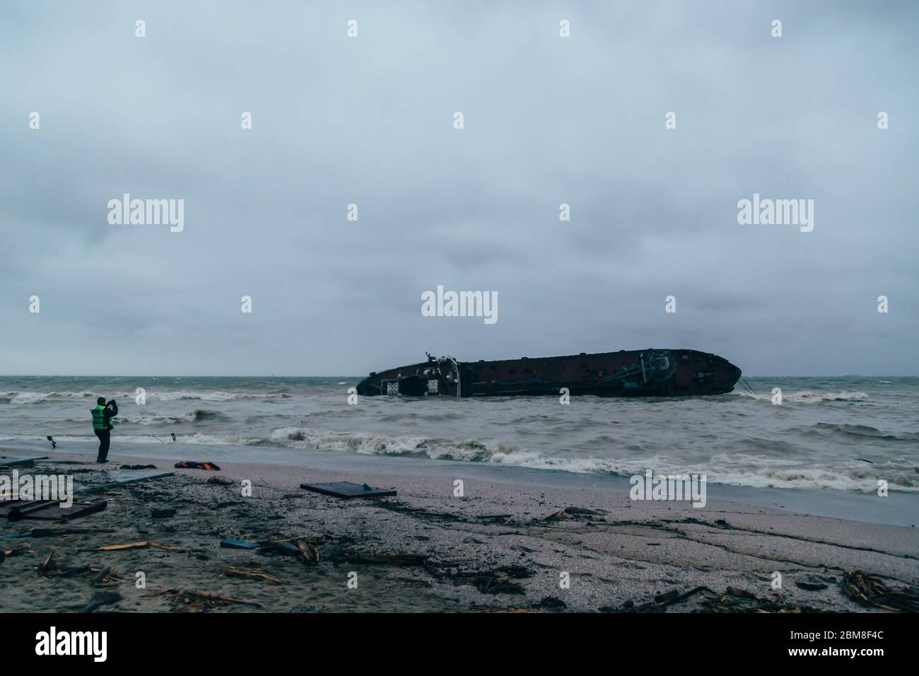 Odessa, Ukraine - November, 22 2019: A shipwreck of a tanker Delfi at the Black Sea coast. Police is trying to assess the scope of the ecological Stock Photo