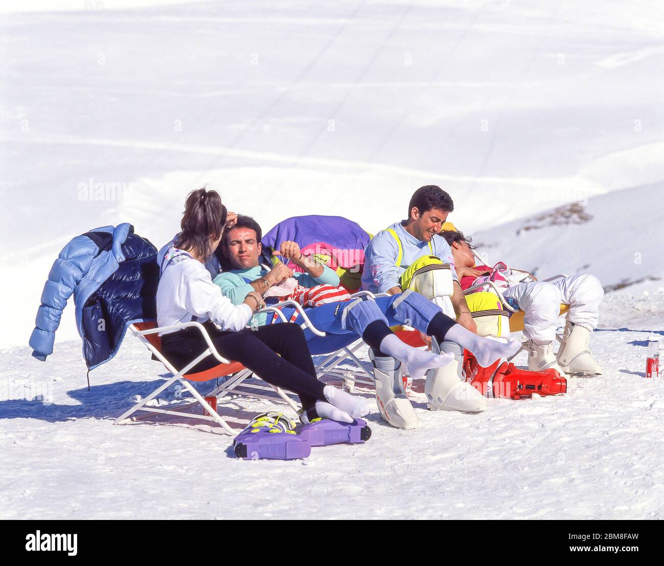 Skiers relaxing on piste, Breuil-Cervinia, Aosta Valley, Italy Stock Photo