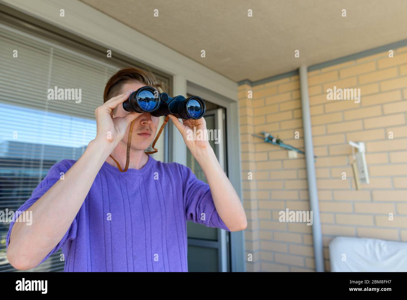 Man binoculars spying hi-res stock photography and images - Alamy