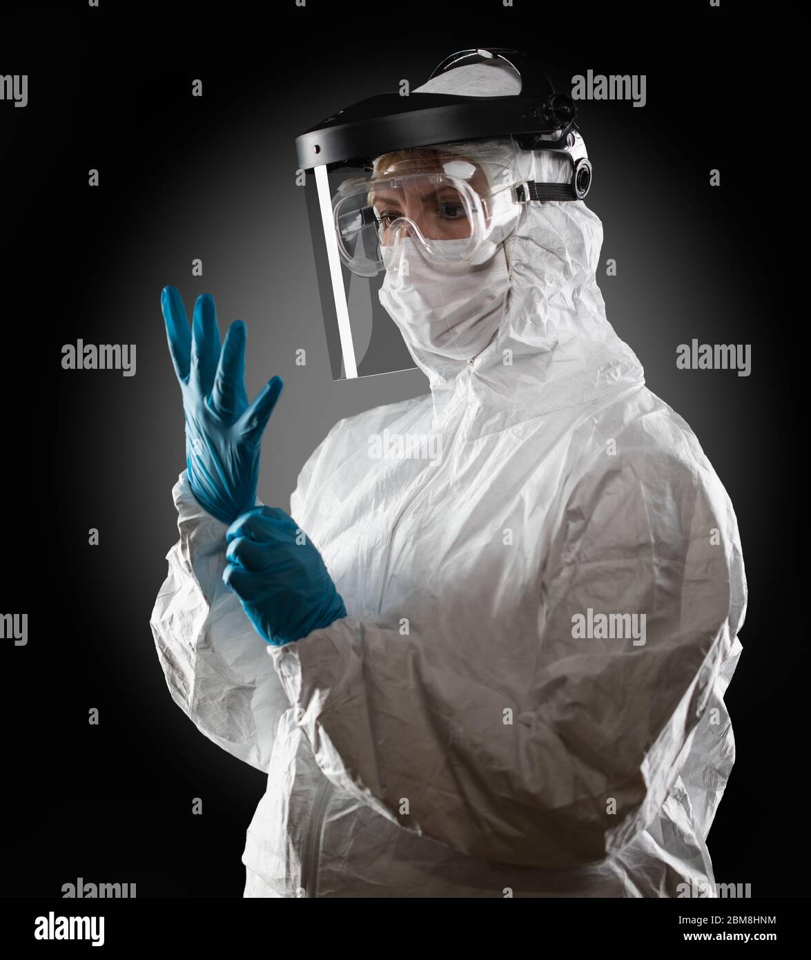 Female Medical Worker Wearing Protective Face Mask and Gear Against ...