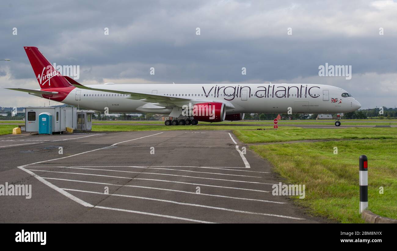 Glasgow, UK. 25 August 2019. Virgin Atlantic Airbus A350-1000 aircraft seen at Glasgow International Airport for pilot training. Virgin's brand new jumbo jet boasts an amazing new 'loft' social space with sofas in business class, and aptly adorned by the registration G-VLUX. The entire aircraft will also have access to high-speed Wi-Fi. Virgin Atlantic has ordered a total of 12 Airbus A350-1000s. They are all scheduled to join the fleet by 2021 in an order worth an estimated $4.4 billion (£3.36 billion). Credit: Colin Fisher/Alamy Live News. Stock Photo