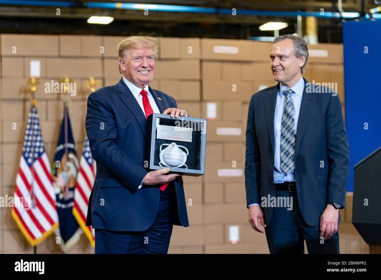 Honeywell CEO Darius Adamczyk presents President Donald Trump with a framed N95 mask after a tour of the mask production assembly line at Honeywell International May 5, 2020 in Phoenix, Arizona. Stock Photo