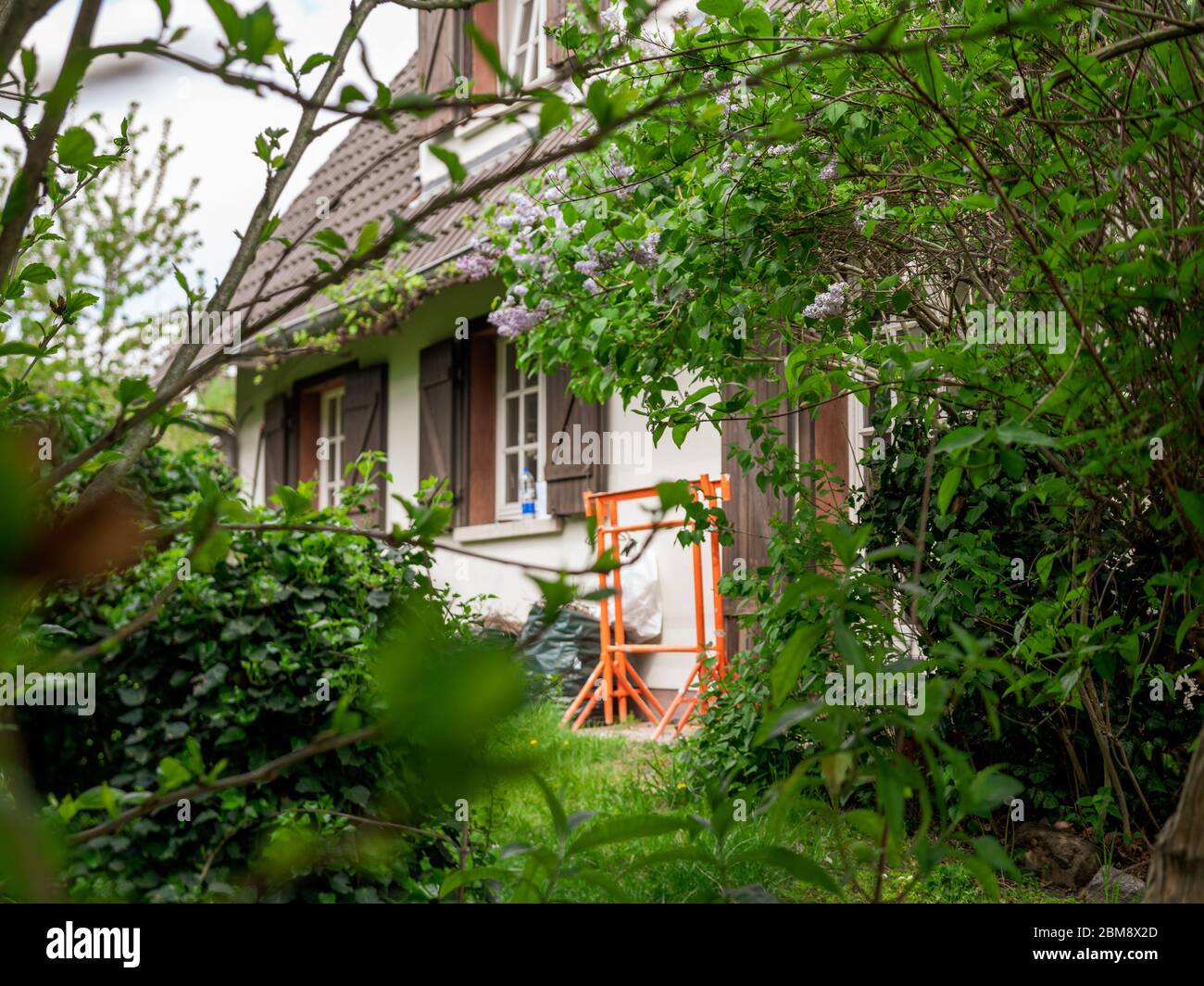 View from the garden at old beautiful French house with construction