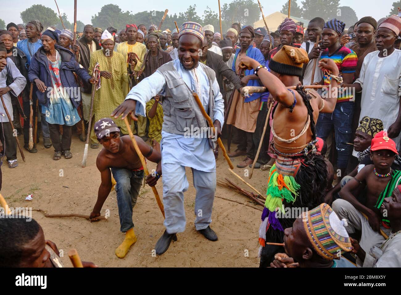 Young Fulani men fighting in a Sharo festival. Sharo is a Fulani festival where young Fulani boys test their strength and endurance by getting flogged Stock Photo - Alamy