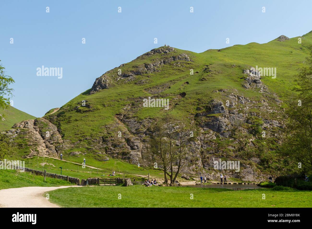 Beautiful Spring day at the Dovedale stepping stones in the Peak District National Park Stock Photo