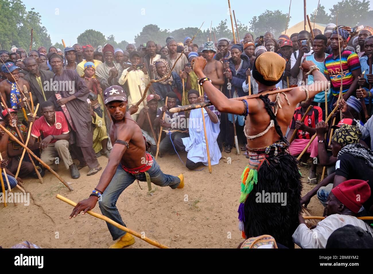 Young Fulani men fighting in a Sharo festival. Sharo is a Fulani festival  where young Fulani boys test their strength and endurance by getting  flogged Stock Photo - Alamy