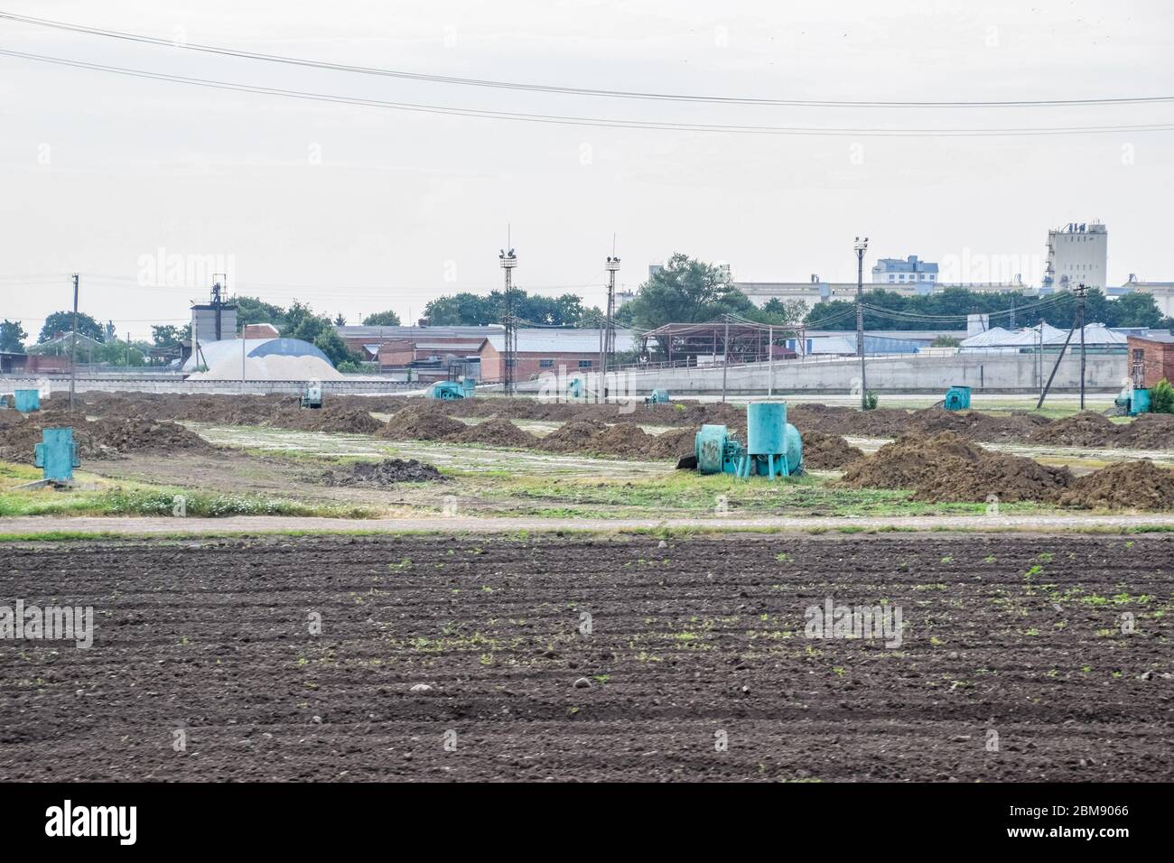 Clay slides are raw materials for a brick factory. Storage of clay for making bricks. Stock Photo