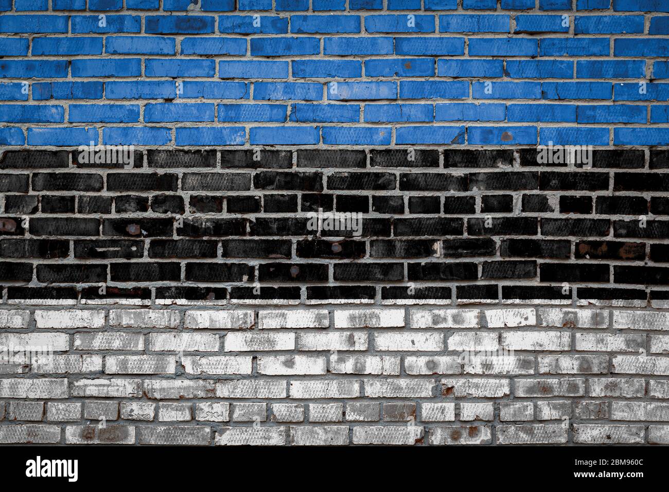 National flag of Estonia depicting in paint colors on an old brick wall ...
